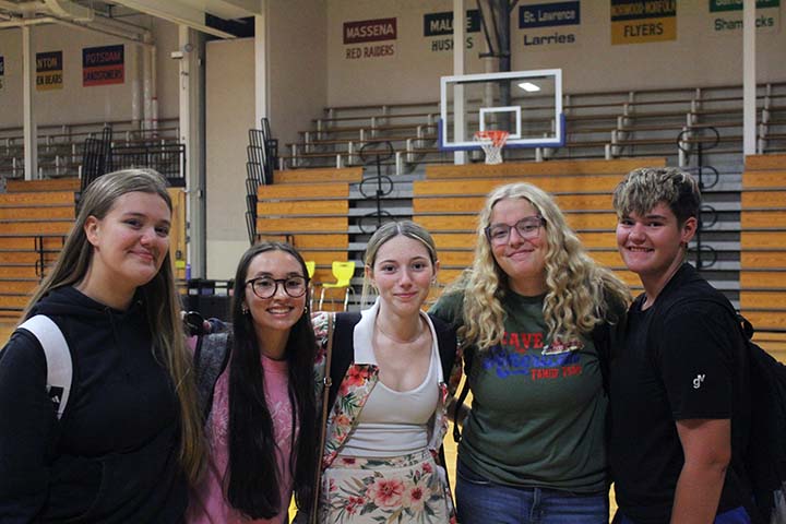 a group of girls posing in the gym