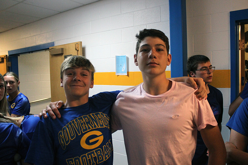 2 male students posing in hallway for picture