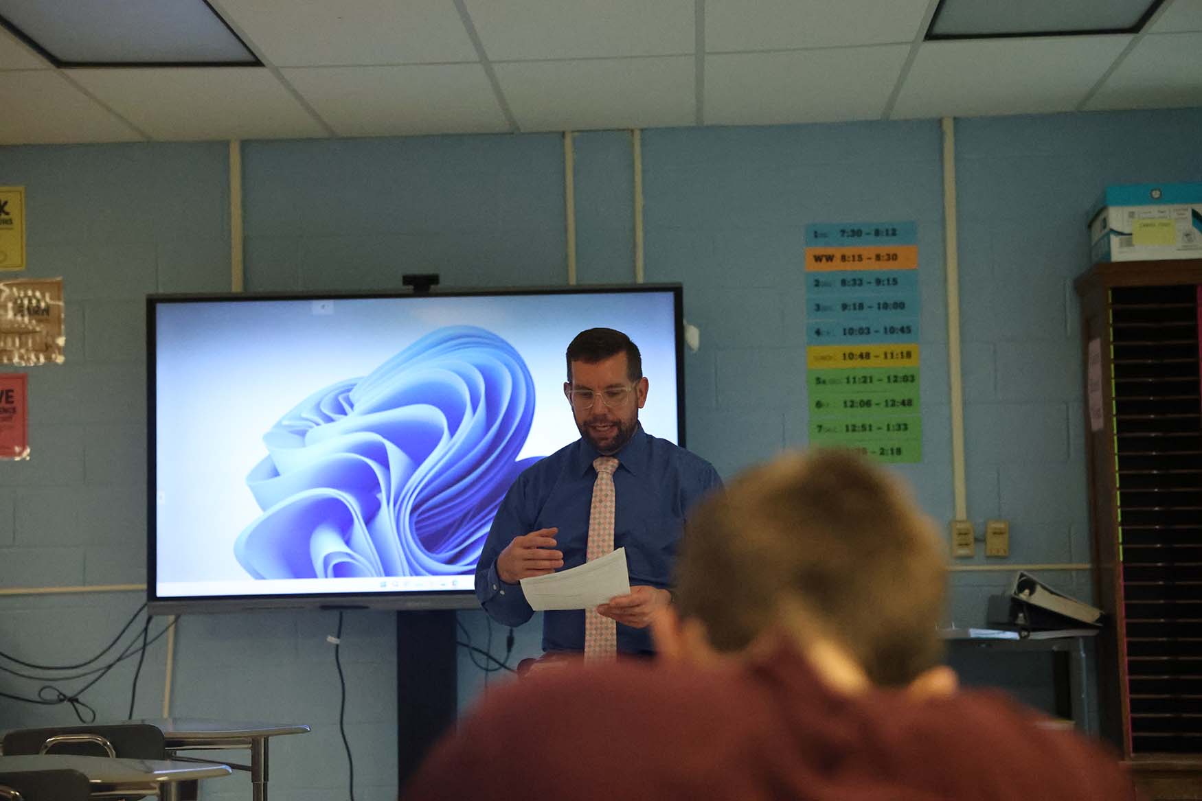 teacher presenting information to students in class