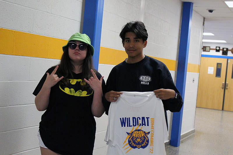 2 students in hallway posing for picture